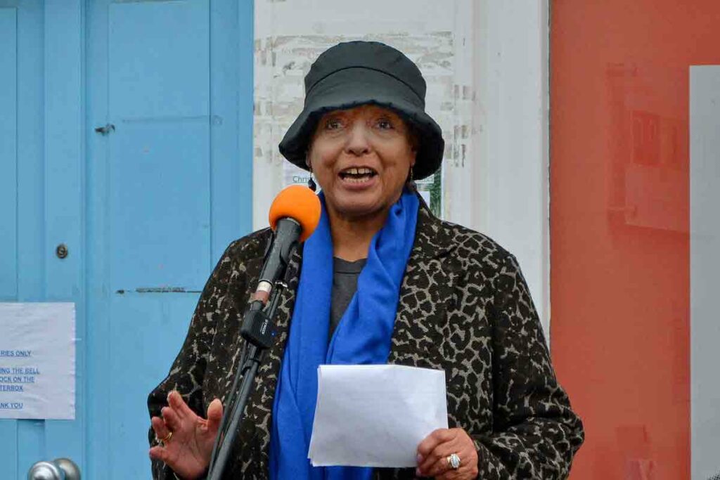 woman speaking at open air meeting